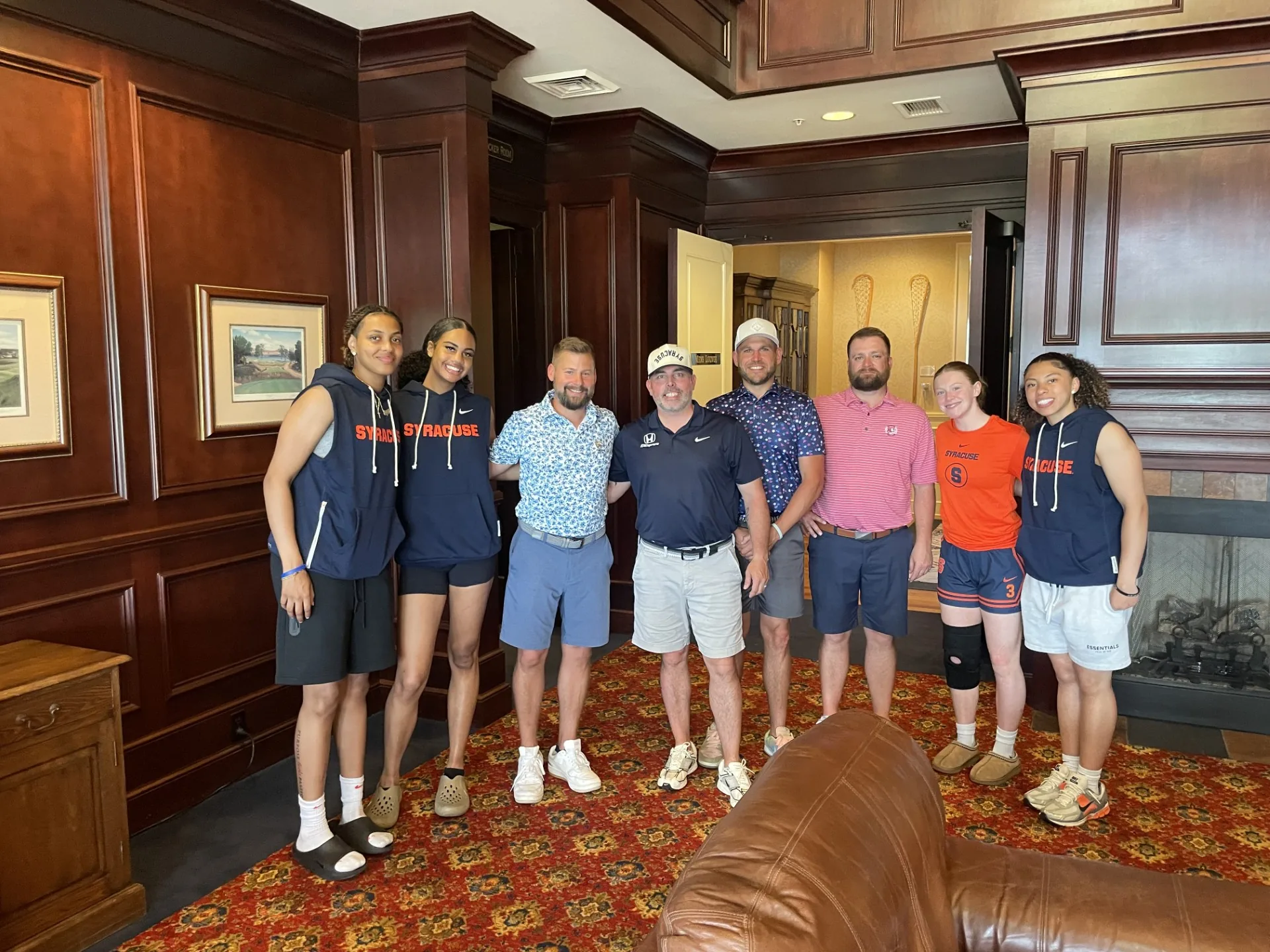 Syracuse student-athletes with supporters at the Athletes Who Care golf outing